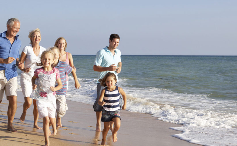 Family Running on the Beach